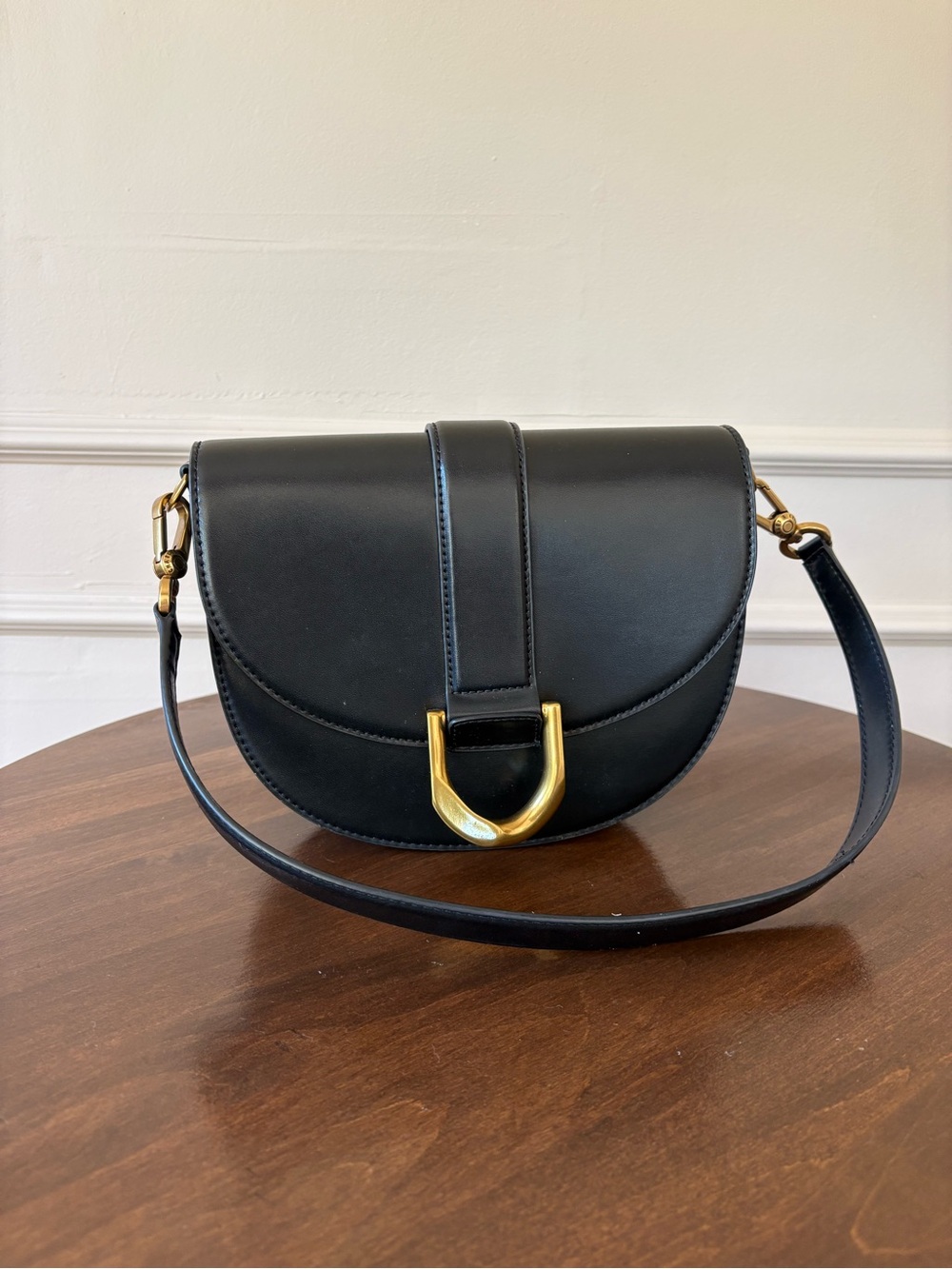 Charles & Keith Black Saddle Crossbody with Gold Hardware